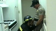 Nasty fire-fighter shoves his dirty cock in the mouth of police officer