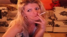 Smoking blonde stripteasing and having fun on webcam